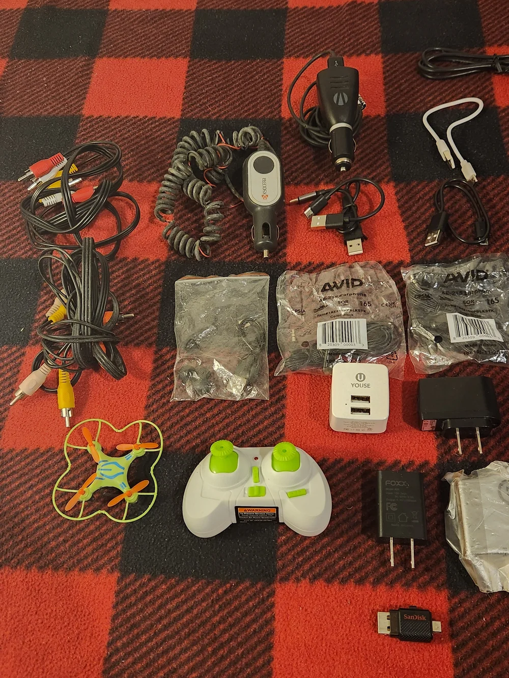 Elctronics Lot, Cellphones, Charging Cords, Remotes, And More